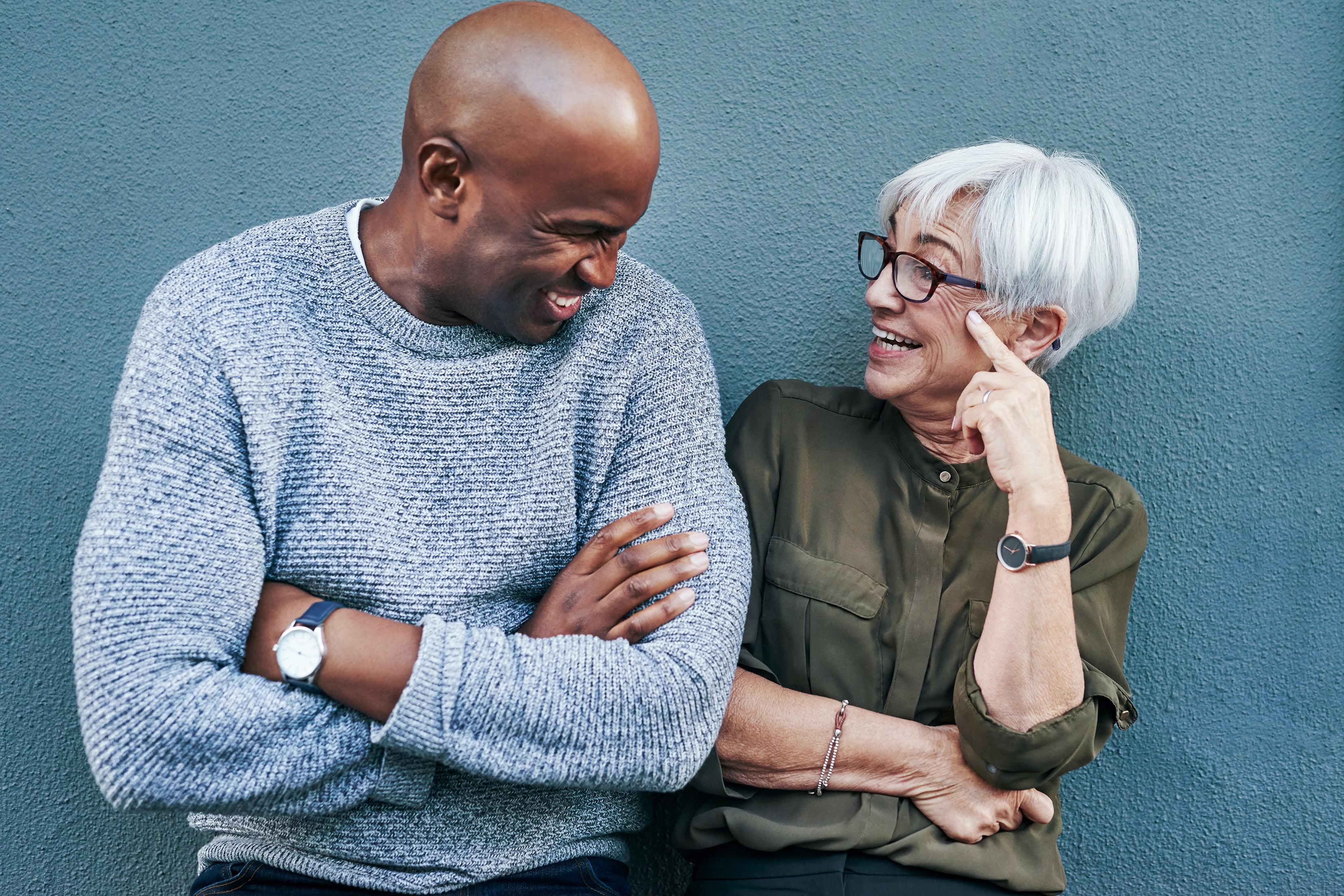 younger man and older woman laughing