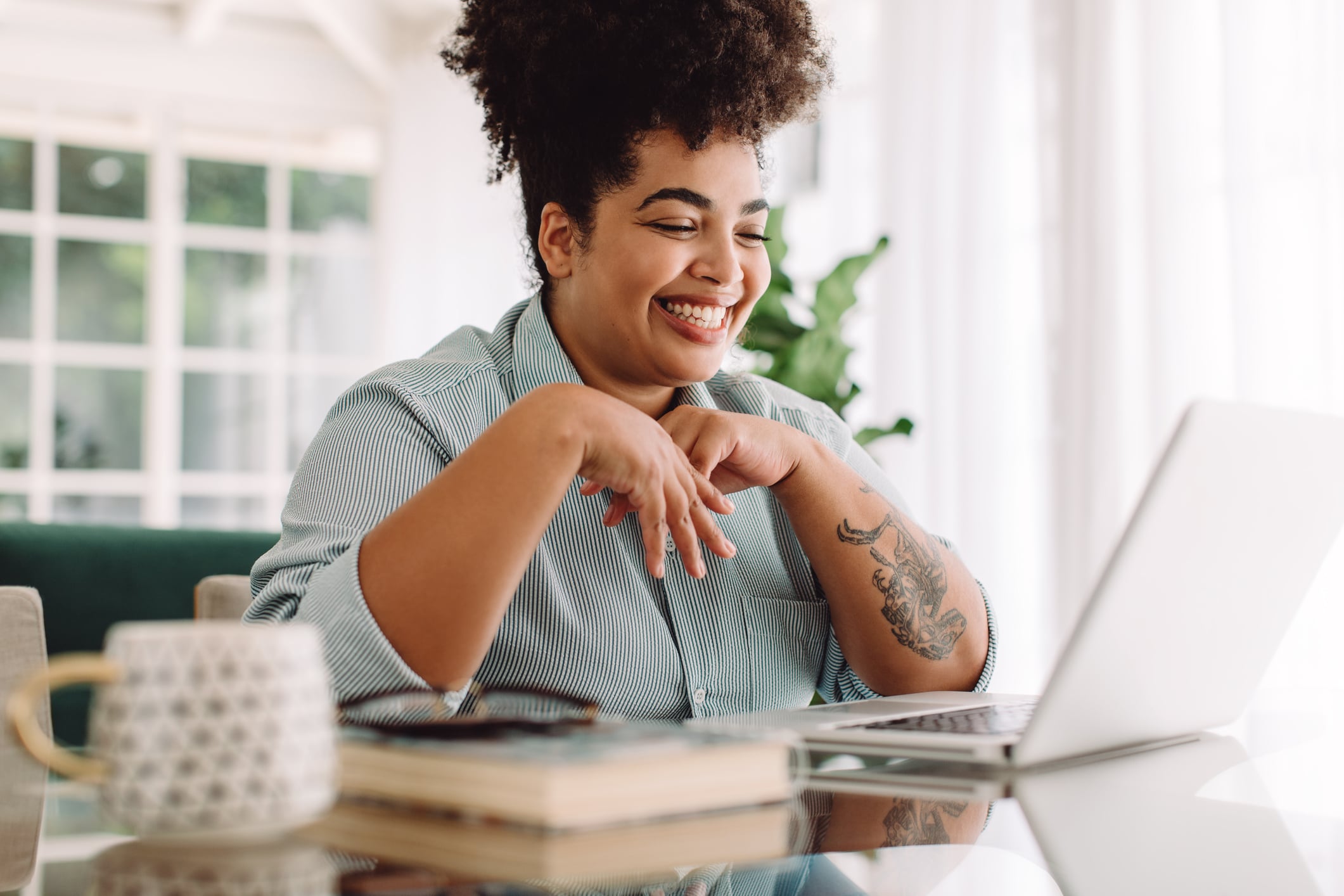 woman sitting at computer - soft check blog